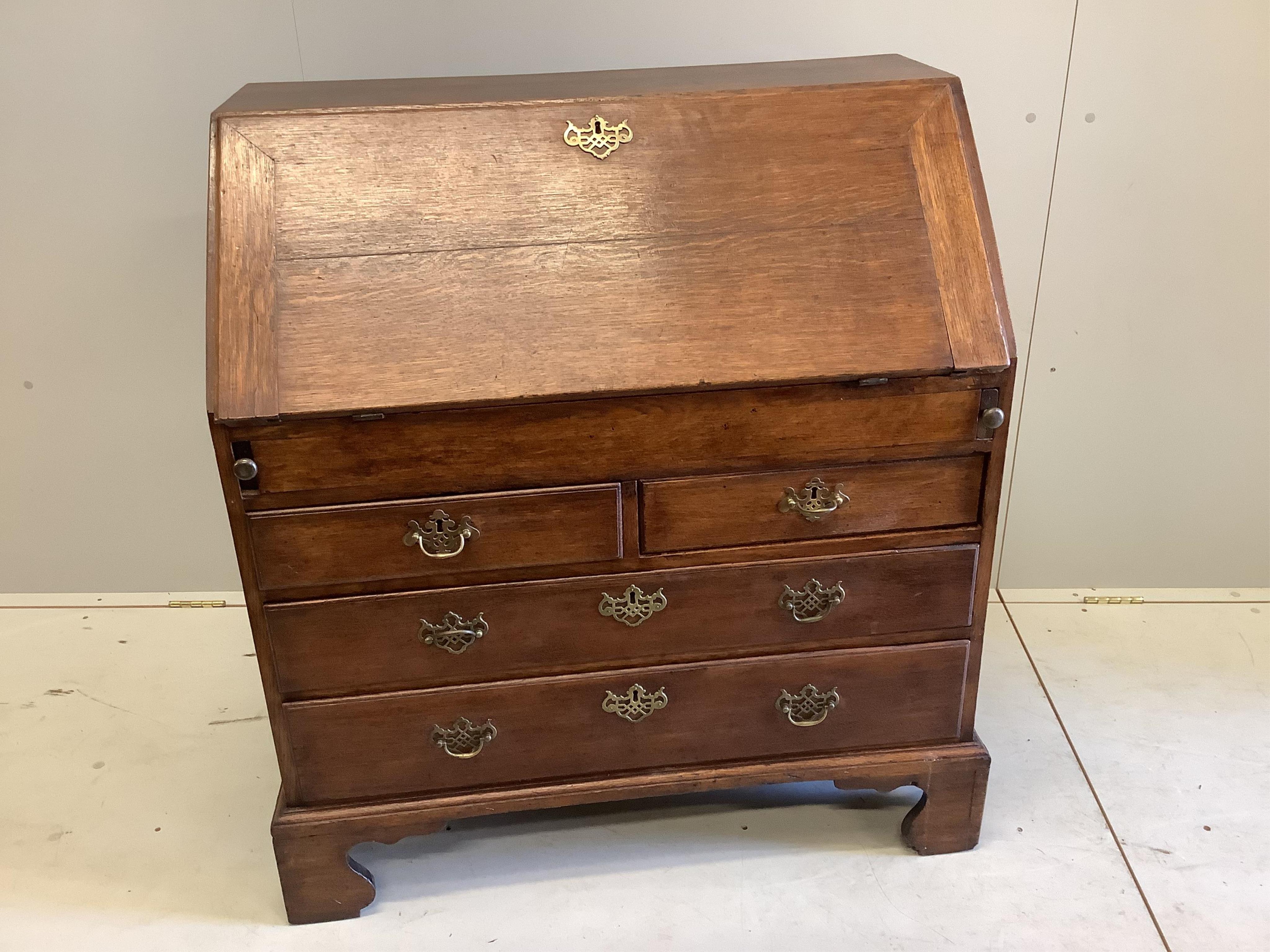 A mid 18th century oak bureau, width 94cm, depth 53cm, height 101cm. Condition - fair